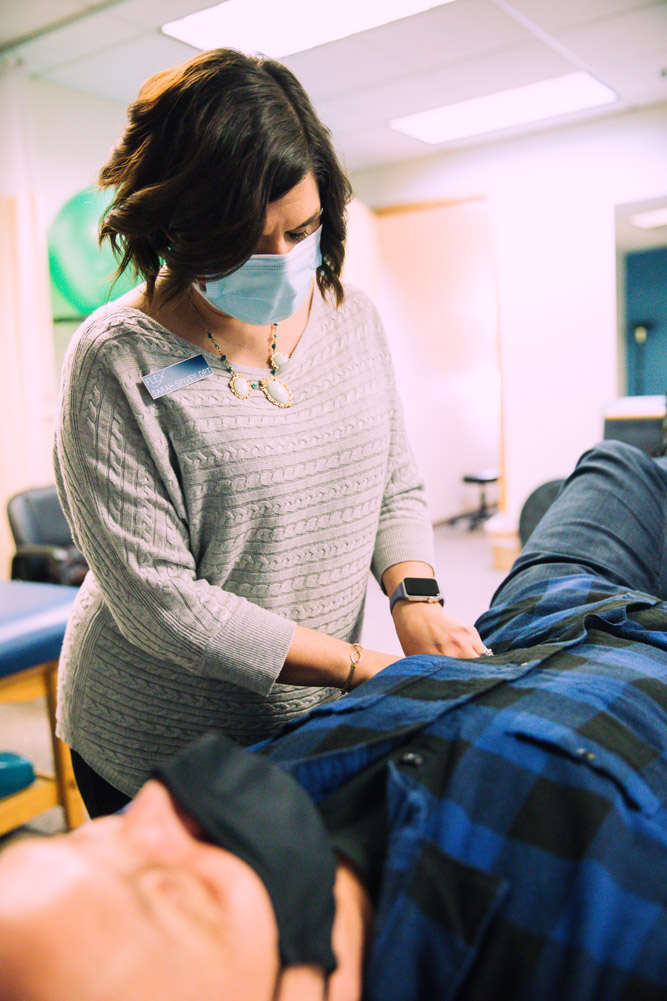 Pelvic-Floor-page-flex-pt-1000 physical therapists works with a patient