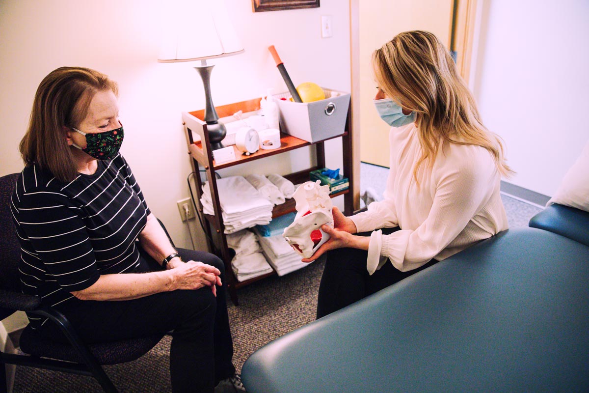 dr ellingson helps a patient learn about the pelvic floor