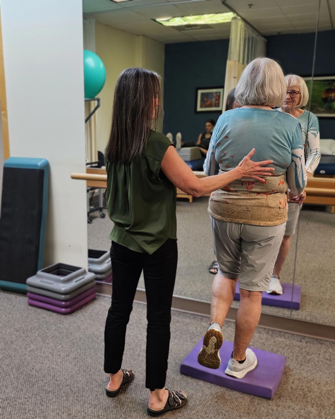 Balance-4-vestibular-blur-opt Diane Thusat helps a patient with a balance exercise